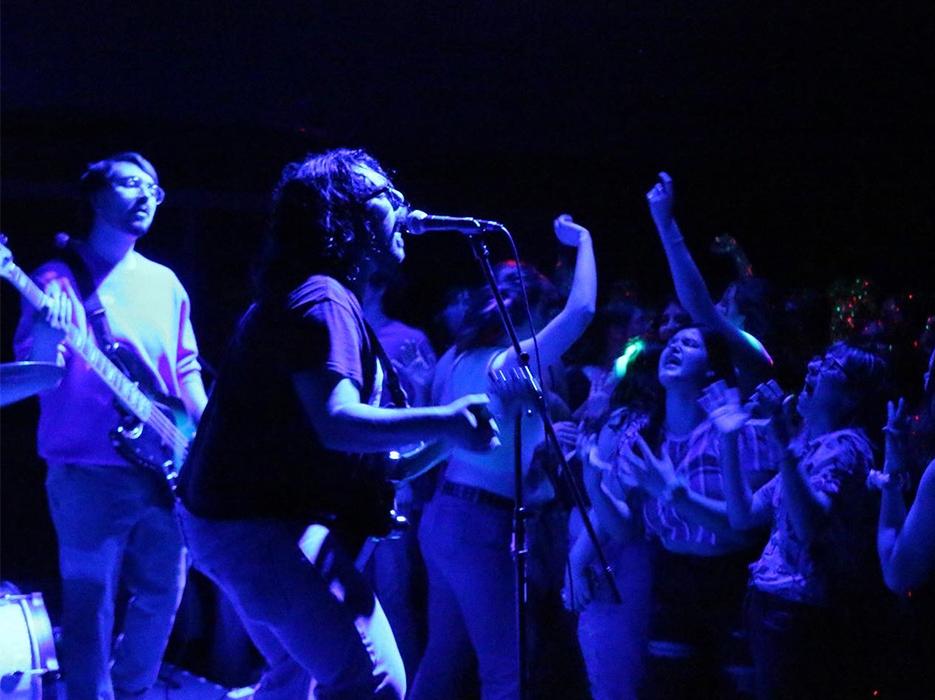 Students dance to the croon of a guest Indie Rock band.